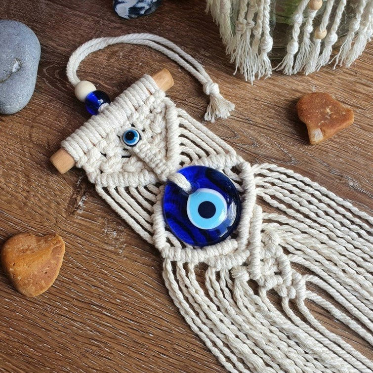 Greek eye amulet; Macramé protection amulet; Evil eye home decor; Protection for home and spaces; Handcrafted Greek eye amulet; Spiritual macramé wall hanging; Greek eye for warding off negativity; Unique protection decor; Evil eye macramé art; Home protection amulet; Greek eye for energy shielding; Boho-style Greek eye amulet; Holistic protection decoration; Amulet for peace and protection; Gift for home blessings; Evil eye symbol for protection;