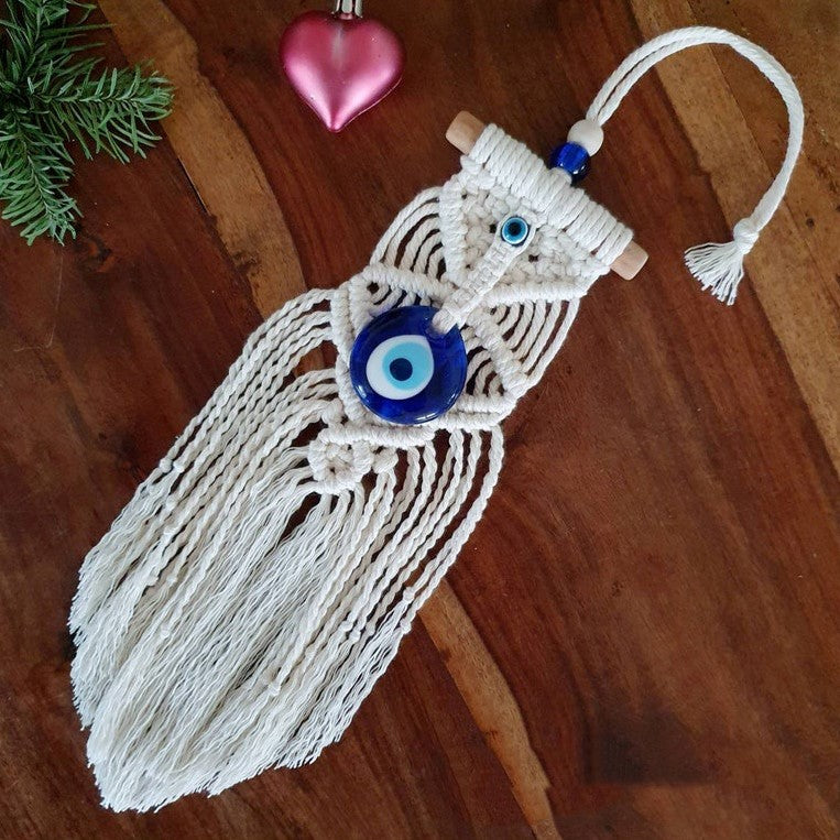 Greek eye amulet; Macramé protection amulet; Evil eye home decor; Protection for home and spaces; Handcrafted Greek eye amulet; Spiritual macramé wall hanging; Greek eye for warding off negativity; Unique protection decor; Evil eye macramé art; Home protection amulet; Greek eye for energy shielding; Boho-style Greek eye amulet; Holistic protection decoration; Amulet for peace and protection; Gift for home blessings; Evil eye symbol for protection;