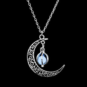 Luminous moon pendant necklace; Glows in the dark jewelry; Moon-inspired glowing necklace; Unique celestial necklace design; Captures the magic of the night sky; Perfect gift for moon lovers; Ethereal glow in the dark pendant; Handcrafted luminous jewelry; Stylish accessory for day or night; Symbol of mystery and elegance; Adds a touch of celestial beauty;