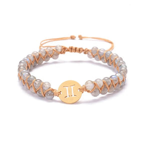 Zodiac bracelet; Braided design; Handcrafted zodiac jewelry; Unique astrological accessory; Artisan-crafted bracelet; Ethically sourced materials; Gift for astrology enthusiasts; Stylish and comfortable for daily wear; Beautiful braided details; Personalized zodiac sign representation; Perfect for layering with other bracelets; Unique spiritual gift; Bracelet for intention setting; Durable and fashionable design; Ideal for any occasion; Symbol of celestial connection; 