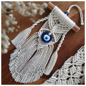 Greek eye amulet; Macramé protection amulet; Evil eye home decor; Protection for home and spaces; Handcrafted Greek eye amulet; Spiritual macramé wall hanging; Greek eye for warding off negativity; Unique protection decor; Evil eye macramé art; Home protection amulet; Greek eye for energy shielding; Boho-style Greek eye amulet; Holistic protection decoration; Amulet for peace and protection; Gift for home blessings; Evil eye symbol for protection;