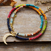 Chakra colors moon necklace; Natural stone necklace with imperial jasper; Enhances chakra alignment and balance; Beautifully designed moon pendant; Supports emotional healing and well-being; Unique blend of colors for each chakra; Ideal gift for spiritual and wellness enthusiasts; Handcrafted with care and attention; Lightweight and comfortable for everyday wear; Perfect for layering with other necklaces;