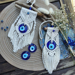 Greek eye amulet; Macramé protection amulet; Evil eye home decor; Protection for home and spaces; Handcrafted Greek eye amulet; Spiritual macramé wall hanging; Greek eye for warding off negativity; Unique protection decor; Evil eye macramé art; Home protection amulet; Greek eye for energy shielding; Boho-style Greek eye amulet; Holistic protection decoration; Amulet for peace and protection; Gift for home blessings; Evil eye symbol for protection;