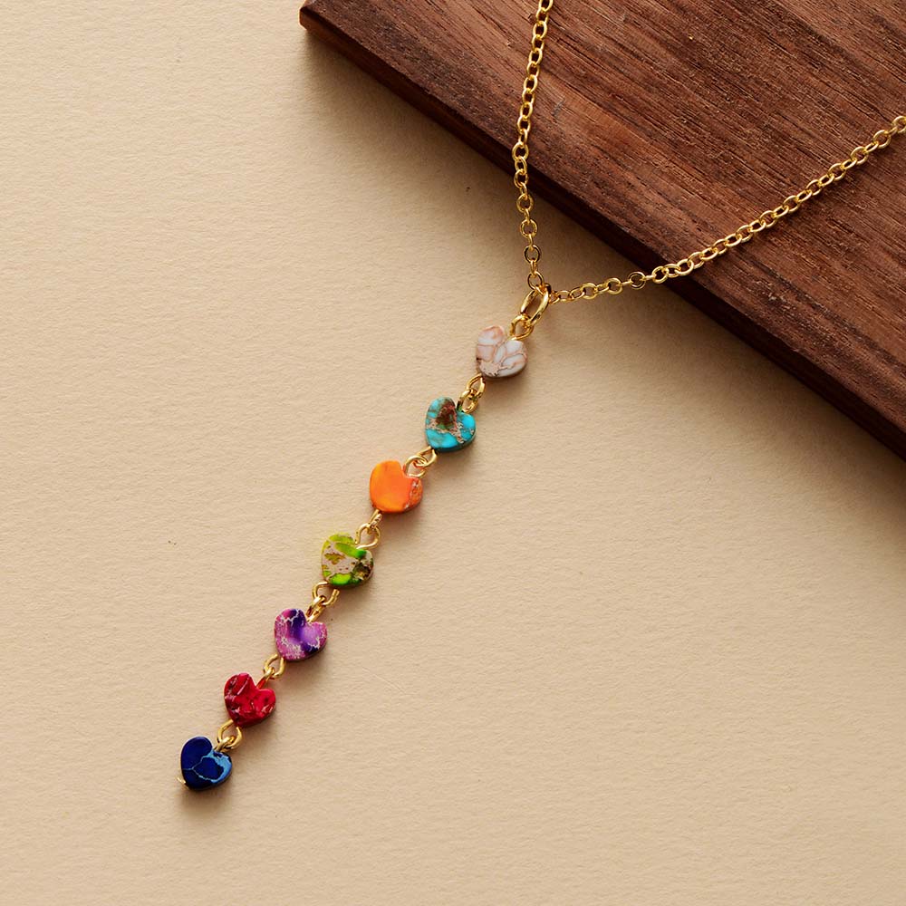 Chakra energy necklace; Aligns and balances chakras; Natural stones for holistic healing; Promotes emotional well-being and balance; Beautifully designed for everyday wear; Enhances spiritual growth and awareness; Ideal gift for wellness enthusiasts; Handcrafted with natural materials; Supports meditation and mindfulness practices; Vibrant colors representing each chakra; Lightweight and comfortable design; Durable and long-lasting energy jewelry;