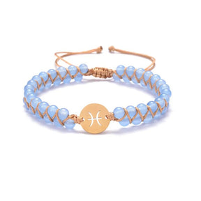 Zodiac bracelet; Braided design; Handcrafted zodiac jewelry; Unique astrological accessory; Artisan-crafted bracelet; Ethically sourced materials; Gift for astrology enthusiasts; Stylish and comfortable for daily wear; Beautiful braided details; Personalized zodiac sign representation; Perfect for layering with other bracelets; Unique spiritual gift; Bracelet for intention setting; Durable and fashionable design; Ideal for any occasion; Symbol of celestial connection; 
