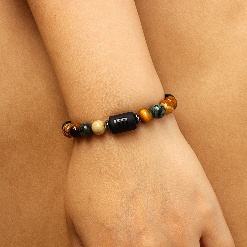 Zodiac sign bracelets; Tiger's Eye bracelet; Handcrafted gemstone jewelry; Unique design for astrological connection; Artisan-crafted accessory; Ethically sourced materials; Gift for astrology enthusiasts; Stylish and meaningful for everyday wear; Durable and fashionable; Beautifully polished Tiger's Eye stones for grounding energy; Unique spiritual gift for zodiac lovers; Bracelet for enhancing intuition and protection; Natural stones for emotional balance and confidence;