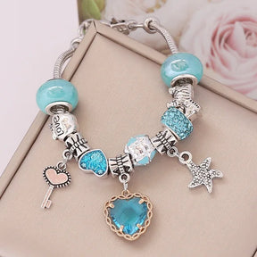 Ocean charm bracelet; Crystal love bracelet; Ocean-inspired jewelry; Healing crystal bracelet; Love and harmony bracelet; Nautical charm bracelet; Sea-themed crystal bracelet; Elegant crystal love jewelry; Ocean breeze bracelet; Crystal bracelet for love; Handcrafted ocean charm bracelet; Natural stone love bracelet; Gemstone bracelet with ocean charm; Ocean crystal bracelet; Love-infused crystal jewelry; Bohemian ocean charm bracelet;