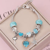 Ocean charm bracelet; Crystal love bracelet; Ocean-inspired jewelry; Healing crystal bracelet; Love and harmony bracelet; Nautical charm bracelet; Sea-themed crystal bracelet; Elegant crystal love jewelry; Ocean breeze bracelet; Crystal bracelet for love; Handcrafted ocean charm bracelet; Natural stone love bracelet; Gemstone bracelet with ocean charm; Ocean crystal bracelet; Love-infused crystal jewelry; Bohemian ocean charm bracelet;