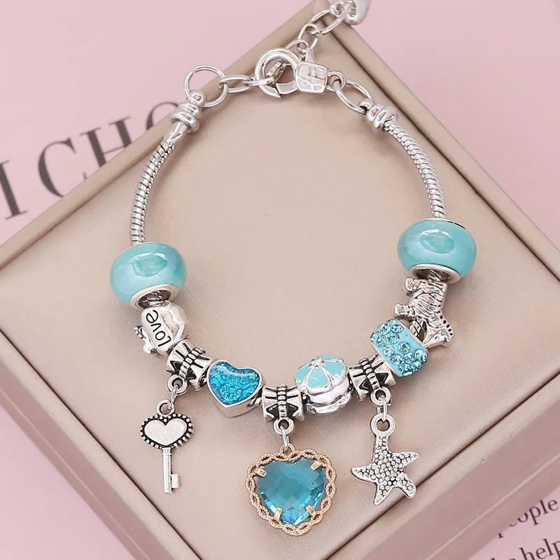 Ocean charm bracelet; Crystal love bracelet; Ocean-inspired jewelry; Healing crystal bracelet; Love and harmony bracelet; Nautical charm bracelet; Sea-themed crystal bracelet; Elegant crystal love jewelry; Ocean breeze bracelet; Crystal bracelet for love; Handcrafted ocean charm bracelet; Natural stone love bracelet; Gemstone bracelet with ocean charm; Ocean crystal bracelet; Love-infused crystal jewelry; Bohemian ocean charm bracelet;