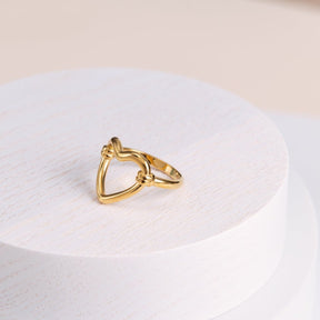 hollow heart ring; 18k gold-plated jewelry; heart-shaped design; romantic gold ring; elegant heart ring; stylish gold accessory; perfect gift for loved ones; trendy heart-shaped jewelry; high-quality gold plating; unique fashion statement; contemporary gold ring; lightweight and delicate; luxurious gold accessory; symbol of love and affection; chic and modern heart ring; timeless elegance in gold; handmade heart ring; sophisticated jewelry piece; minimalist heart jewelry; delicate and stylish ring; 