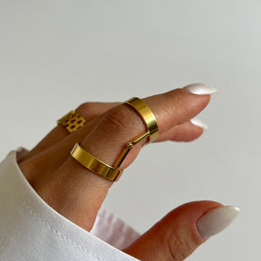 adjustable ring; articulated ring; 18k gold plated ring; elegant adjustable jewelry; versatile gold ring; luxury gold accessory; adjustable fit; stylish and unique design; perfect for every finger; fashion-forward ring; modern gold ring; high-quality gold finish; perfect gift for her; minimalist yet bold; durable and adjustable; chic and comfortable; everyday elegance; sophisticated and trendy; statement jewelry; gold-plated perfection; handcrafted jewelry; 