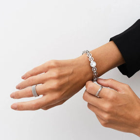 iconic spheres ring; silver jewelry; modern design ring; unique statement piece; elegant silver accessory; high-quality craftsmanship; stylish and contemporary; perfect gift for her; versatile wear; minimalist aesthetic; timeless elegance; chic fashion ring; adjustable fit; eye-catching spheres; sophisticated and sleek; luxurious appearance; refined beauty; intricate detailing; fashionable silver ring; unique gift idea; perfect for special occasions;
