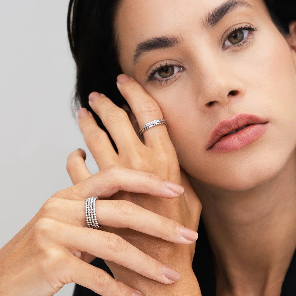 iconic spheres ring; silver jewelry; modern design ring; unique statement piece; elegant silver accessory; high-quality craftsmanship; stylish and contemporary; perfect gift for her; versatile wear; minimalist aesthetic; timeless elegance; chic fashion ring; adjustable fit; eye-catching spheres; sophisticated and sleek; luxurious appearance; refined beauty; intricate detailing; fashionable silver ring; unique gift idea; perfect for special occasions;