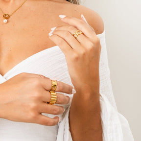 groove ring; 18k gold plated jewelry; modern design; stylish and sophisticated; unique groove detailing; elegant accessory; perfect for everyday wear; statement piece; handcrafted quality; versatile ring; comfortable fit; ideal for stacking; trendy and fashionable; luxurious shine; timeless elegance; exceptional craftsmanship; unique gift idea; bold fashion statement; contemporary style; must-have accessory; radiant finish; durable and long-lasting; flattering for all hands; eye-catching detail; 