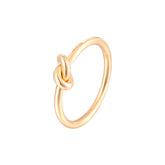 knot ring; 18k gold-plated jewelry; elegant knot design; unique gold ring; stylish knot ring; handcrafted gold accessory; trendy knot ring; fashionable jewelry piece; perfect gift for her; luxurious knot ring; versatile gold ring; modern design ring; beautiful gold-plated ring; timeless jewelry piece; sophisticated knot design; lightweight and comfortable wear; chic gold accessory; stunning gold ring; statement piece of jewelry; exquisite craftsmanship; perfect for stacking; fashionable and trendy ring;