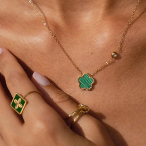 adjustable green clover ring; 18k gold plated jewelry; lucky charm accessory; elegant and stylish; perfect for everyday wear; symbolizes good luck; handcrafted with care; unique gift for her; versatile and trendy; beautiful green hue; customizable fit for all sizes; fashionable and meaningful; enhances any outfit; ideal for stacking rings; lightweight and comfortable; exquisite gold finish; perfect for special occasions; charming addition to your jewelry collection; great gift for birthdays; 