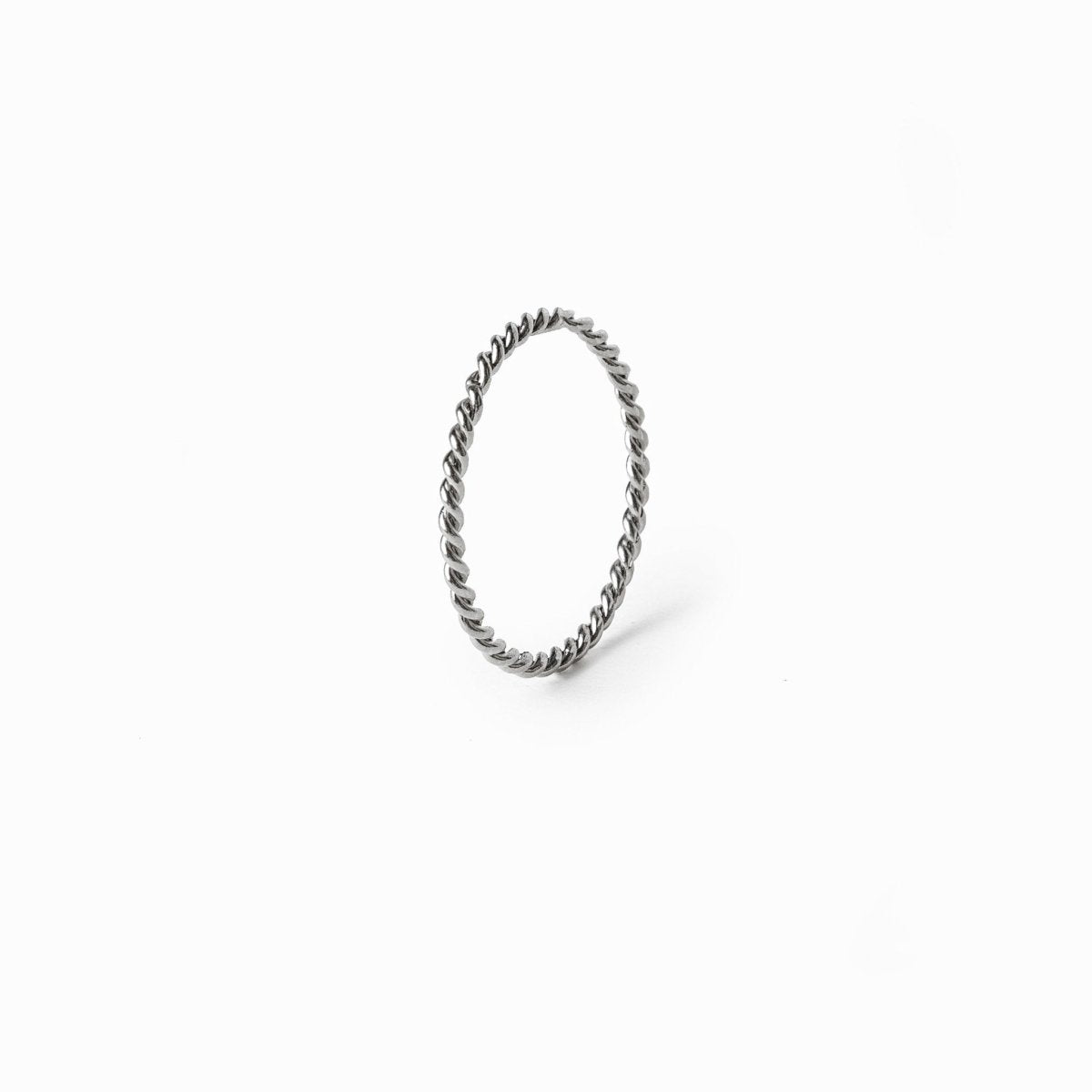 Silver twist ring; elegant twisted design; modern silver jewelry; stylish statement piece; unique spiral ring; perfect for stacking; versatile accessory for any occasion; sophisticated and chic; lightweight and comfortable; ideal gift for her; enhances everyday outfits; contemporary silver finish; unique craftsmanship; durable and long-lasting; adds a touch of elegance; great for casual or formal wear; perfect for layering with other rings;