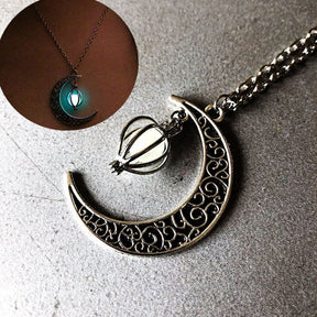 Luminous moon pendant necklace; Glows in the dark jewelry; Moon-inspired glowing necklace; Unique celestial necklace design; Captures the magic of the night sky; Perfect gift for moon lovers; Ethereal glow in the dark pendant; Handcrafted luminous jewelry; Stylish accessory for day or night; Symbol of mystery and elegance; Adds a touch of celestial beauty;