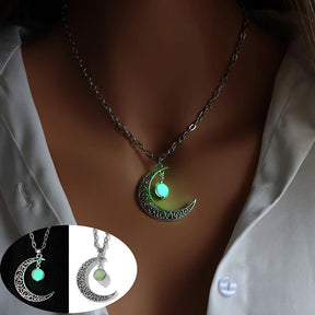 Luminous moon pendant necklace; Glows in the dark jewelry; Moon-inspired glowing necklace; Unique celestial necklace design; Captures the magic of the night sky; Perfect gift for moon lovers; Ethereal glow in the dark pendant; Handcrafted luminous jewelry; Stylish accessory for day or night; Symbol of mystery and elegance; Adds a touch of celestial beauty;