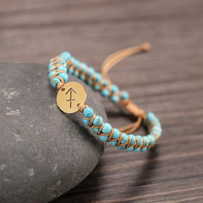 Zodiac bracelet; Braided design; Handcrafted zodiac jewelry; Unique astrological accessory; Artisan-crafted bracelet; Ethically sourced materials; Gift for astrology enthusiasts; Stylish and comfortable for daily wear; Beautiful braided details; Personalized zodiac sign representation; Perfect for layering with other bracelets; Unique spiritual gift; Bracelet for intention setting; Durable and fashionable design; Ideal for any occasion; Symbol of celestial connection; 