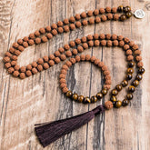 Rudraksha japamala; Tiger Eye beads mala; Handcrafted prayer beads; Unique meditation necklace; Spiritual jewelry; Gift with free bracelet; Artisan-crafted japamala; Natural stone beads; Japamala for mindfulness; Ethically sourced materials; Japamala for mantra repetition; Beautiful beaded necklace; Unique spiritual gift; Calming meditation accessory; Rudraksha for spiritual growth; Tiger Eye for protection; Japamala for intention setting; Stylish spiritual accessory;