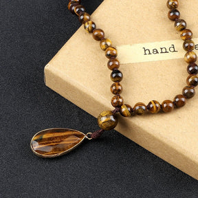 108 bead japamala; Tiger's Eye medal necklace; Handcrafted prayer beads; Spiritual jewelry; Artisan-crafted japamala; Natural Tiger's Eye beads; Japamala for mindfulness; Gift for meditation practitioners; Japamala for focus and protection; Healing energy necklace; Tiger's Eye for confidence and strength; Unique meditation necklace; Japamala for mantra repetition; Calming meditation accessory; Beautiful beaded necklace; Unique spiritual gift;