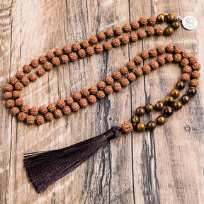 Rudraksha japamala; Tiger Eye beads mala; Handcrafted prayer beads; Unique meditation necklace; Spiritual jewelry; Gift with free bracelet; Artisan-crafted japamala; Natural stone beads; Japamala for mindfulness; Ethically sourced materials; Japamala for mantra repetition; Beautiful beaded necklace; Unique spiritual gift; Calming meditation accessory; Rudraksha for spiritual growth; Tiger Eye for protection; Japamala for intention setting; Stylish spiritual accessory;