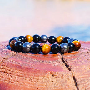 Triple protection bracelet; Protection, power, and balance bracelet; Handcrafted gemstone jewelry; Unique design for spiritual shielding; Artisan-crafted accessory; Ethically sourced materials; Gift for those seeking strength and security; Stylish and protective for everyday wear; Durable and fashionable; Beautifully polished stones for protection and grounding; Unique spiritual gift; Bracelet for enhancing personal power and stability; Natural stones for emotional balance and inner strength;