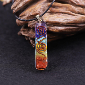 Orgonite energy flow necklace; 7 chakras amulet for balance; Enhances energy flow and healing; Unique blend of natural crystals and resin; Promotes emotional well-being and harmony; Beautifully crafted for everyday wear; Supports spiritual growth and protection; Ideal gift for holistic health enthusiasts; Handcrafted with care and intention; Vibrant colors representing each chakra; Lightweight and comfortable design;