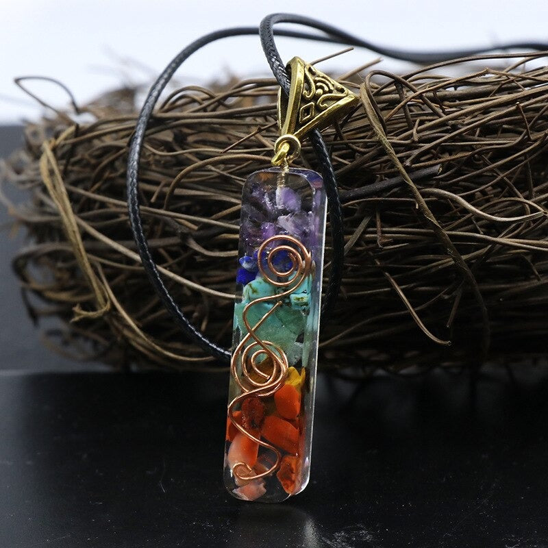 Orgonite energy flow necklace; 7 chakras amulet for balance; Enhances energy flow and healing; Unique blend of natural crystals and resin; Promotes emotional well-being and harmony; Beautifully crafted for everyday wear; Supports spiritual growth and protection; Ideal gift for holistic health enthusiasts; Handcrafted with care and intention; Vibrant colors representing each chakra; Lightweight and comfortable design;