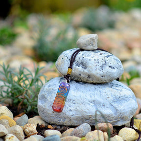 Orgonite energy flow necklace; 7 chakras amulet for balance; Enhances energy flow and healing; Unique blend of natural crystals and resin; Promotes emotional well-being and harmony; Beautifully crafted for everyday wear; Supports spiritual growth and protection; Ideal gift for holistic health enthusiasts; Handcrafted with care and intention; Vibrant colors representing each chakra; Lightweight and comfortable design;