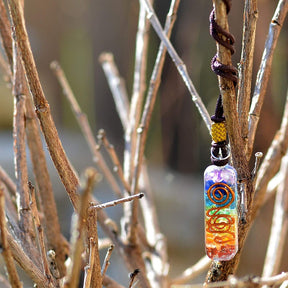 Orgonite energy flow necklace; 7 chakras amulet for balance; Enhances energy flow and healing; Unique blend of natural crystals and resin; Promotes emotional well-being and harmony; Beautifully crafted for everyday wear; Supports spiritual growth and protection; Ideal gift for holistic health enthusiasts; Handcrafted with care and intention; Vibrant colors representing each chakra; Lightweight and comfortable design;