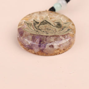 Orgonite lotus flower necklace; Handcrafted spiritual jewelry; Unique design symbolizing purity and enlightenment; Artisan-crafted accessory; Ethically sourced materials; Gift for those seeking peace and spiritual growth; Stylish and meaningful for everyday wear; Durable and fashionable; Beautifully detailed lotus flower for spiritual connection; Unique spiritual gift; Necklace for enhancing positive energy and protection; Natural elements for emotional healing and balance;