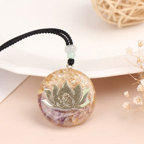 Orgonite lotus flower necklace; Handcrafted spiritual jewelry; Unique design symbolizing purity and enlightenment; Artisan-crafted accessory; Ethically sourced materials; Gift for those seeking peace and spiritual growth; Stylish and meaningful for everyday wear; Durable and fashionable; Beautifully detailed lotus flower for spiritual connection; Unique spiritual gift; Necklace for enhancing positive energy and protection; Natural elements for emotional healing and balance;