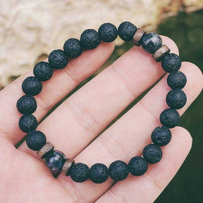Tibetan bracelet; Volcanic lava stone bracelet; Handcrafted spiritual jewelry; Unique design for grounding and strength; Artisan-crafted accessory; Ethically sourced volcanic lava; Gift for those seeking stability; Stylish and rugged for everyday wear; Durable and fashionable; Beautifully textured lava beads; Unique spiritual gift; Bracelet for protection and emotional balance; Natural stones for personal empowerment; Lightweight and comfortable; Ideal for meditation practices;