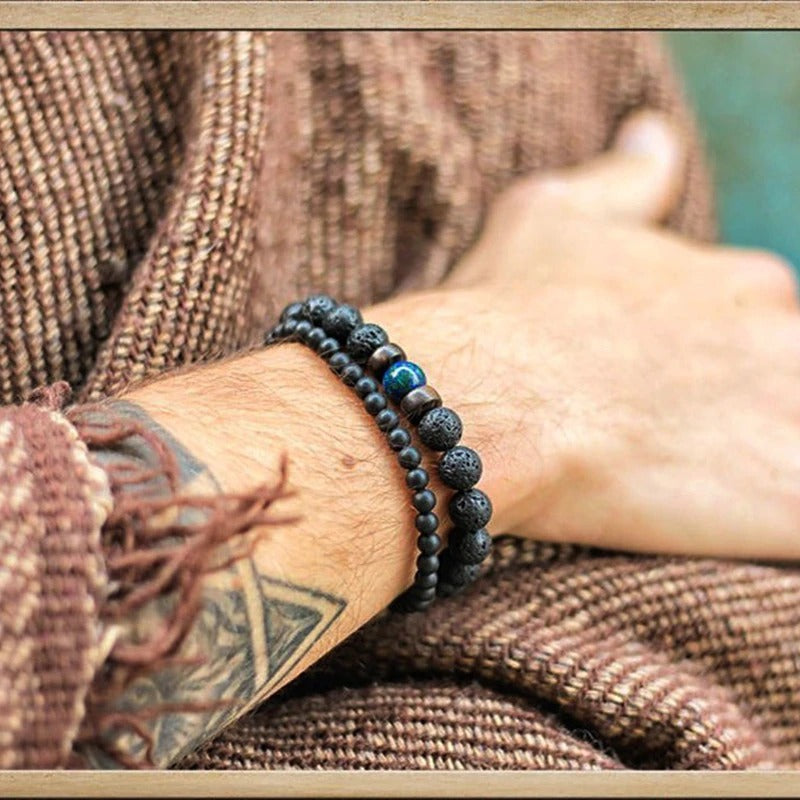 Tibetan bracelet; Volcanic lava stone bracelet; Handcrafted spiritual jewelry; Unique design for grounding and strength; Artisan-crafted accessory; Ethically sourced volcanic lava; Gift for those seeking stability; Stylish and rugged for everyday wear; Durable and fashionable; Beautifully textured lava beads; Unique spiritual gift; Bracelet for protection and emotional balance; Natural stones for personal empowerment; Lightweight and comfortable; Ideal for meditation practices; 
