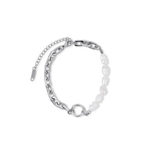 Silver bracelet; elegant accessory; discreet luxury; sophisticated fashion; refined style; silver shine; delicate jewellery; luxurious detail; elegant design; impeccable finish; perfect gift; timeless fashion; versatile accessory; classic beauty; subtle glamour; feminine style; high quality; exclusive piece; silver charm; touch of elegance.