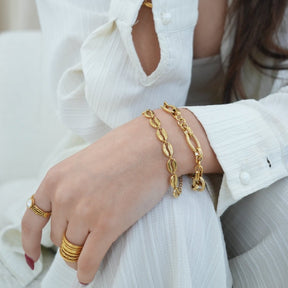 gold-plated bracelet; elegant gold-plated bracelet; handcrafted gold-plated bracelet; gold jewellery; gold bangle; artisanal gold-plated bracelet; gold wrist accessory; classic gold-plated bracelet; chic gold-plated bracelet; designer gold-plated bracelet; minimalist gold-plated bracelet; gold charm bracelet; high-quality gold-plated bracelet; fashionable gold-plated bracelet; gold-plated bracelet gift; 