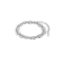 silver bracelet; sterling silver bracelet; elegant silver bracelet; handcrafted silver bracelet; silver jewellery; silver bangle; sterling silver bangle; artisanal silver bracelet; silver wrist accessory; classic silver bracelet; chic silver bracelet; designer silver bracelet; minimalist silver bracelet; silver charm bracelet;